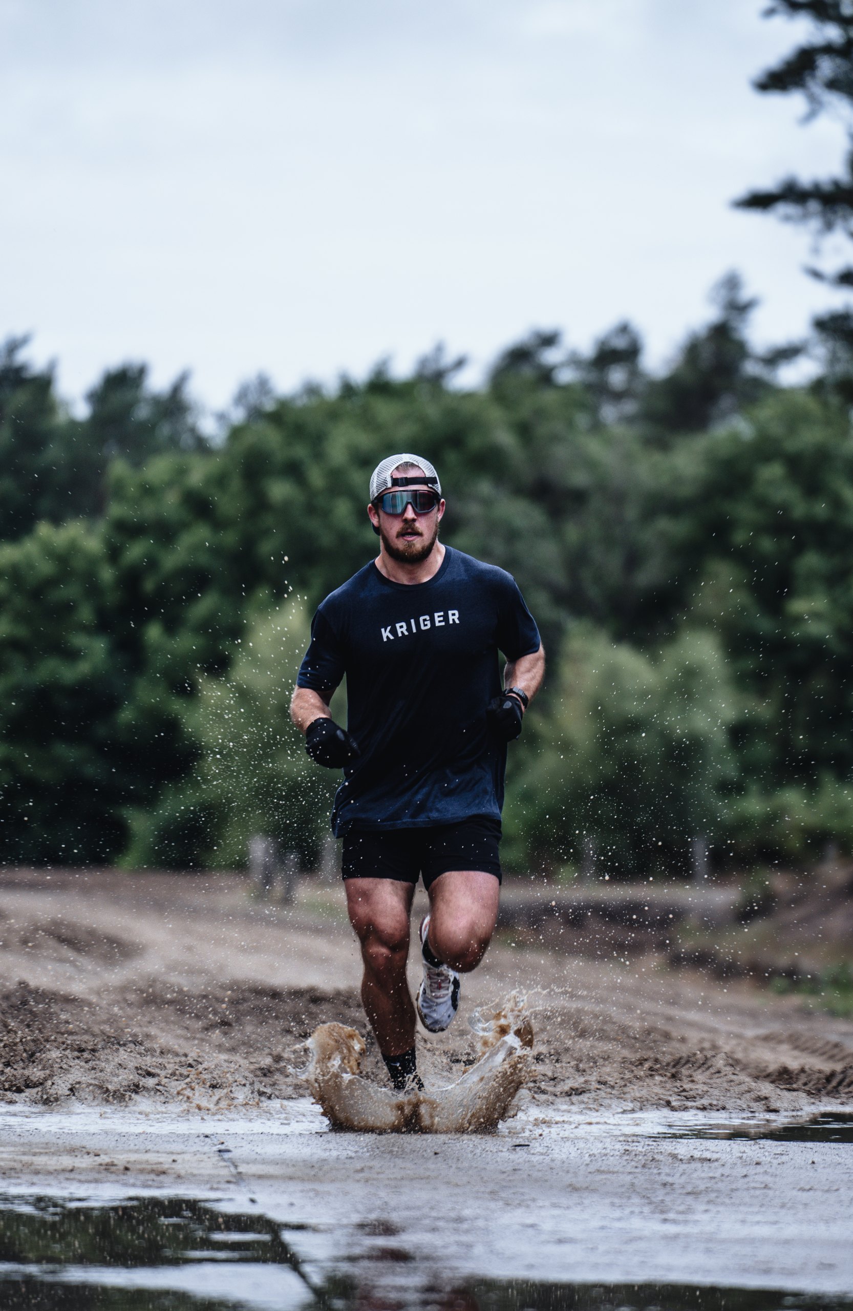 Christian Hartmann running through water during competition